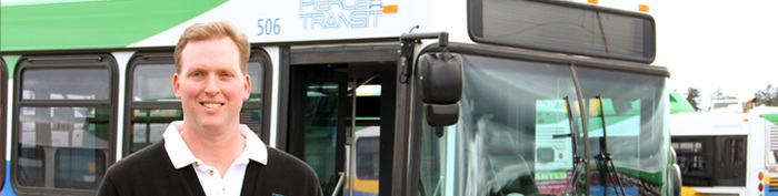 picture of operator in front of bus