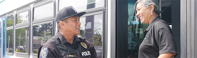 Ride in Safety with Pierce Transit, operator talking to police officer